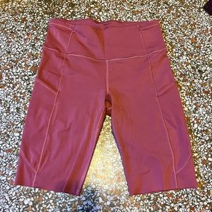 Lululemon bike shorts in raspberry. Size 8, laser cut, lots of pockets